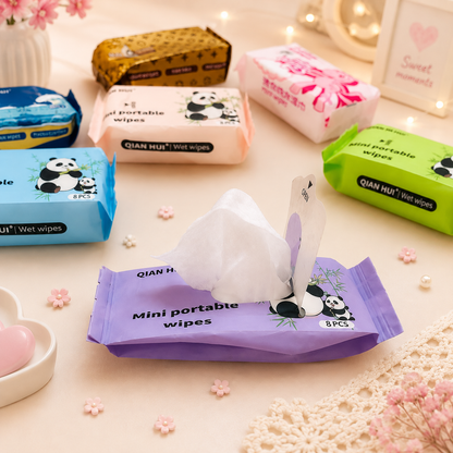 Purple panda mini portable wipes pack open with wipe pulled out