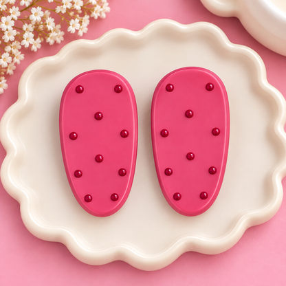 Pair of burgundy polka dot oval hair clips