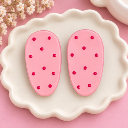 Pair of black and white polka dot oval hair clips
