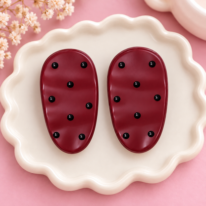 Pair of cream polka dot oval hair clips
