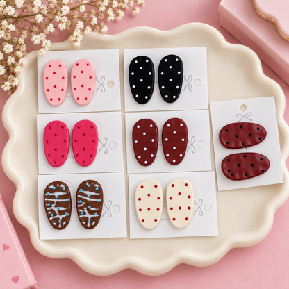 Pair of pink polka dot oval hair clips