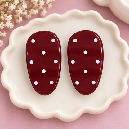 Pair of bright pink oval hair clips